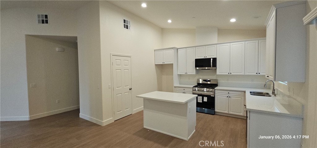 13449 Mesquite Road Whitewater, CA 92282 - Photo 6 of 13 a kitchen with a sink stainless steel appliances and cabinets