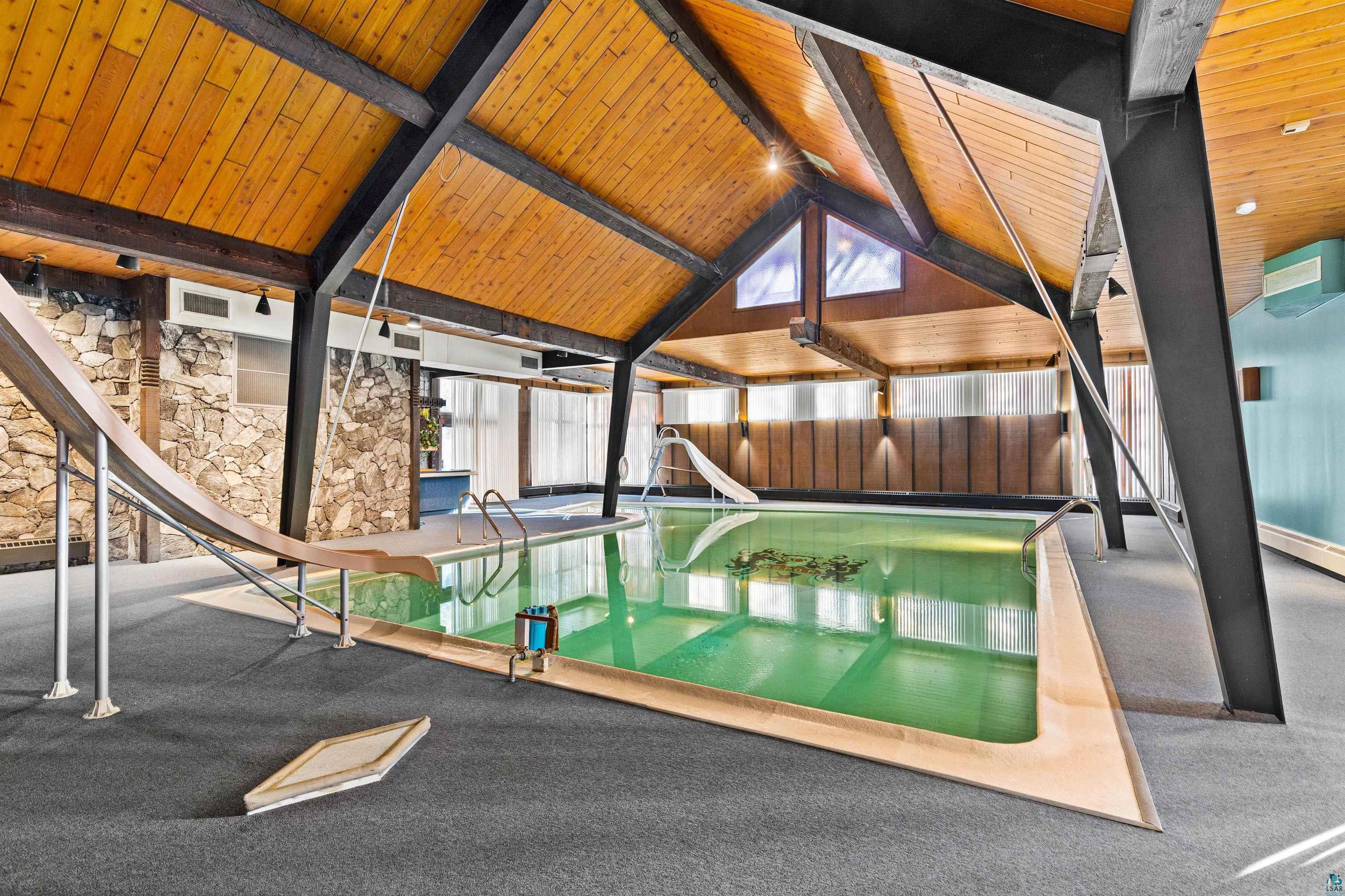 5781 South Pike Lake Road Duluth, MN 55811 - Photo 14 of 42 Indoor pool with a water slide and a jacuzzi