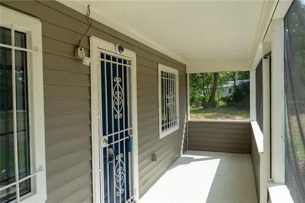 a view of kitchen with kitchen island wooden floor and ceiling fan
