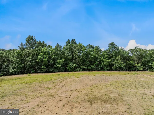 a view of white pool with a yard