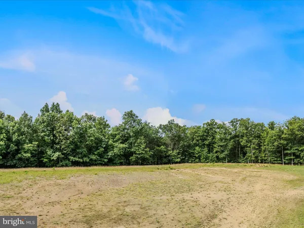 a view of a big yard with a house