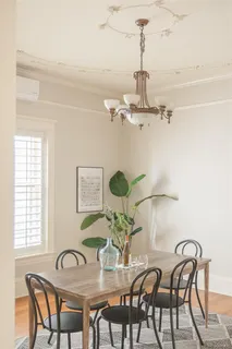a kitchen with granite countertop a stove a sink and cabinets