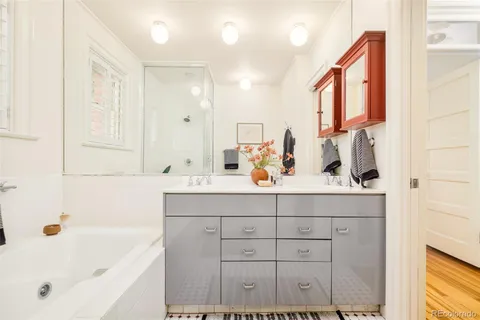 a bathroom with a bathtub and a shower
