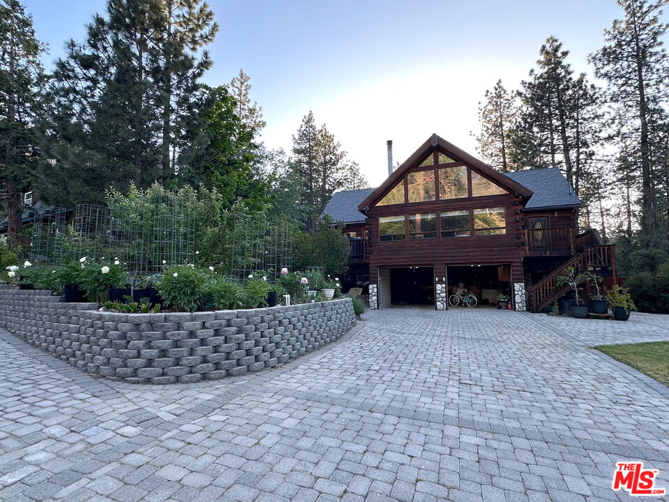 490 Lark Road Wrightwood, CA 92397 - Photo 17 of 18 a front view of a house with a garden