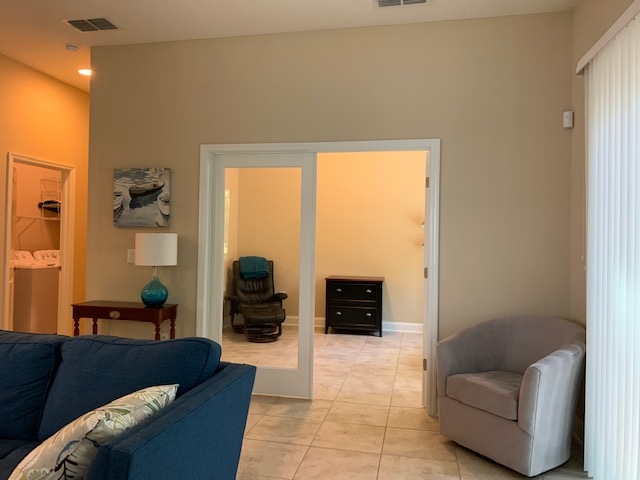 99 CanyonTrail St. Augustine, FL 32086 - Photo 16 of 19 a living room with furniture and a gate