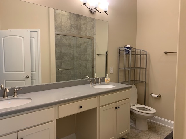 99 CanyonTrail St. Augustine, FL 32086 - Photo 17 of 19 a bathroom with a sink toilet and shower