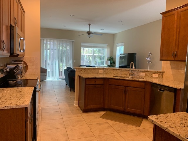 99 CanyonTrail St. Augustine, FL 32086 - Photo 4 of 19 a bathroom with a granite countertop sink and a mirror