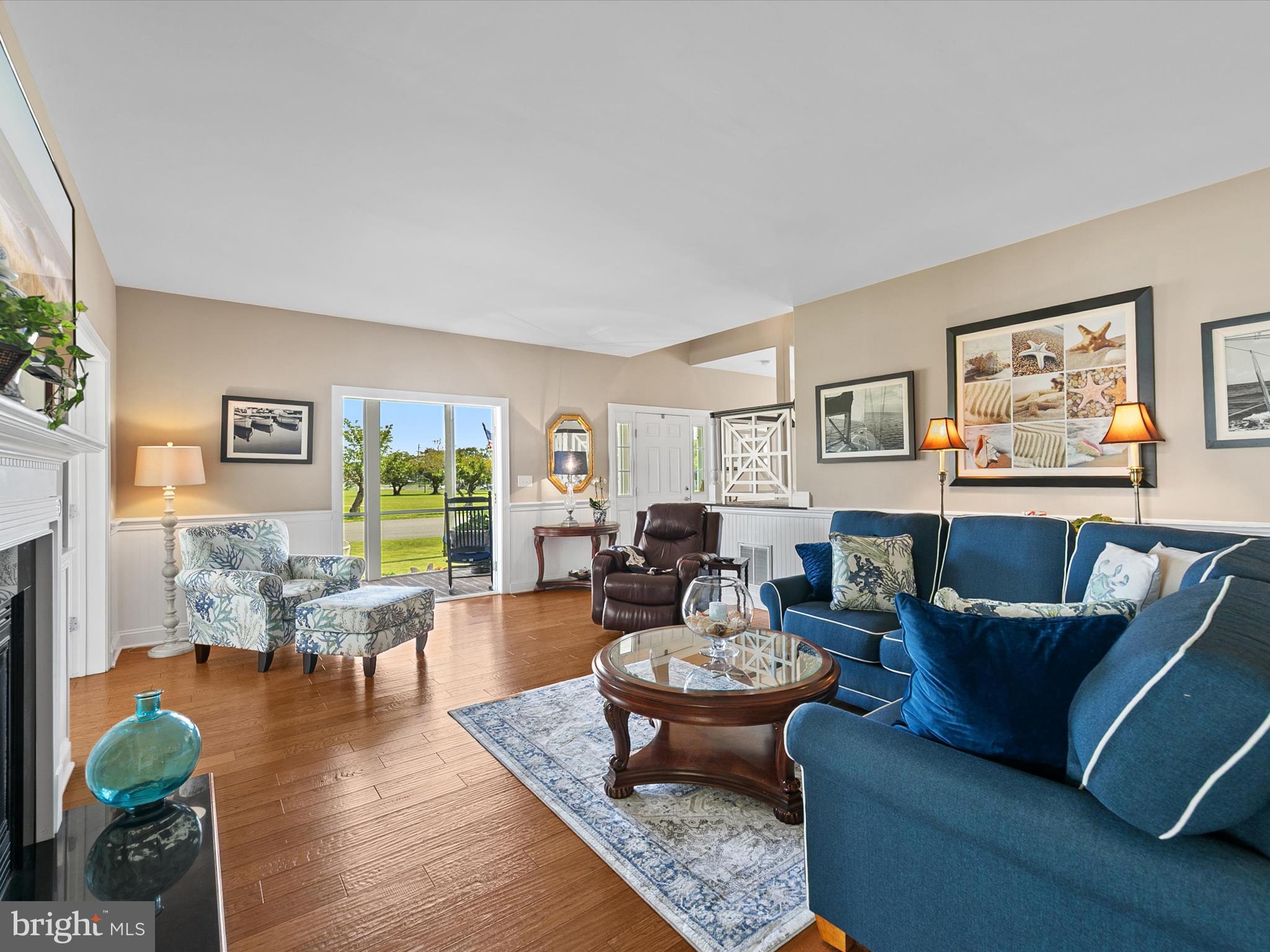 515 Stockley St Extension Rehoboth Beach, DE 19971 - Photo 13 of 104 a living room with furniture wooden floor and a fireplace