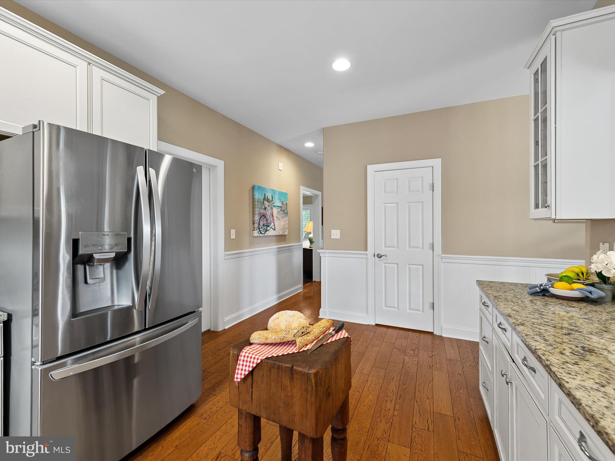 515 Stockley St Extension Rehoboth Beach, DE 19971 - Photo 26 of 104 a kitchen with stainless steel appliances granite countertop a refrigerator and a stove top oven