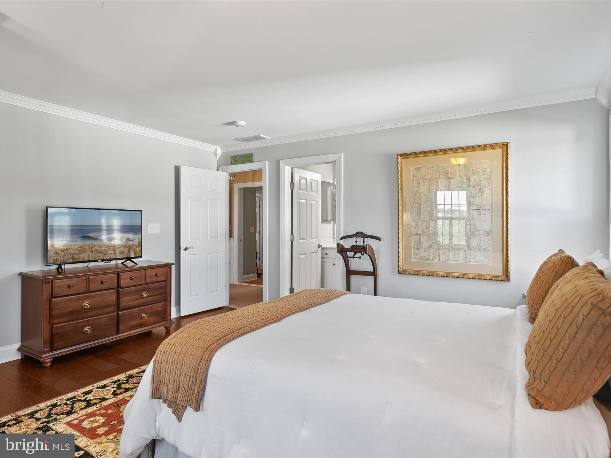 515 Stockley St Extension Rehoboth Beach, DE 19971 - Photo 45 of 104 a bedroom with a bed and a dresser