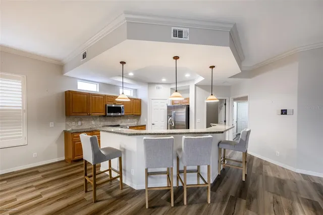 a kitchen with a table and chairs in it