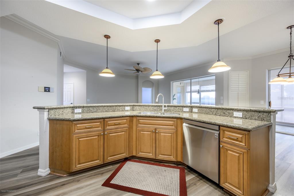 3959 San Rocco Drive, Unit 612 Punta Gorda, FL 33950 - Photo 16 of 41 a kitchen with center island and stainless steel appliances