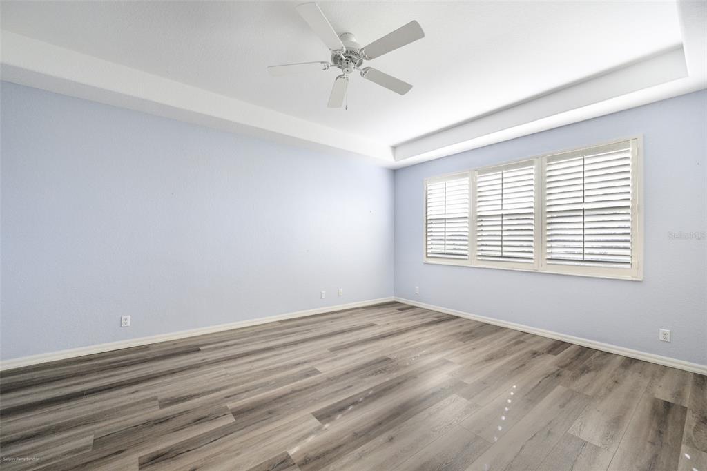 3959 San Rocco Drive, Unit 612 Punta Gorda, FL 33950 - Photo 17 of 41 wooden floor in an empty room with a window