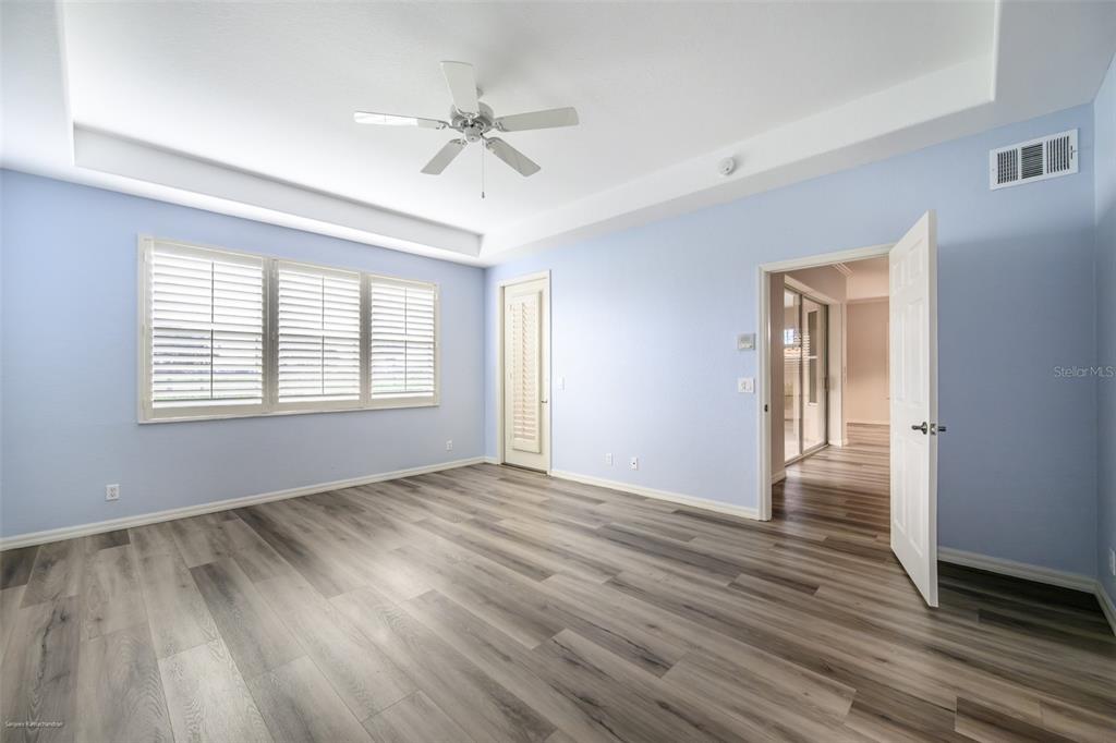 3959 San Rocco Drive, Unit 612 Punta Gorda, FL 33950 - Photo 18 of 41 a view of an empty room with wooden floor and a window