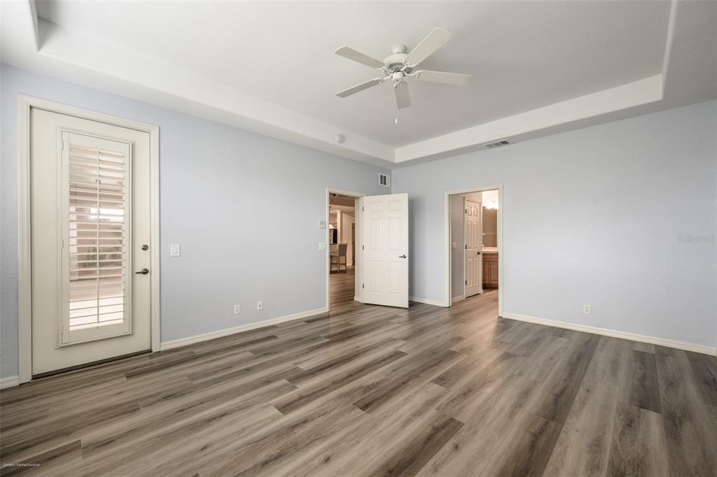 3959 San Rocco Drive, Unit 612 Punta Gorda, FL 33950 - Photo 19 of 41 a view of an empty room with wooden floor and a window
