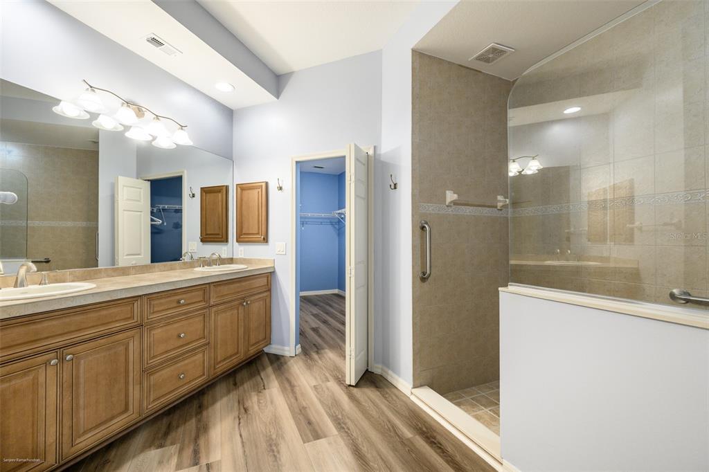 3959 San Rocco Drive, Unit 612 Punta Gorda, FL 33950 - Photo 20 of 41 a bathroom with a double vanity sink a large mirror and shower