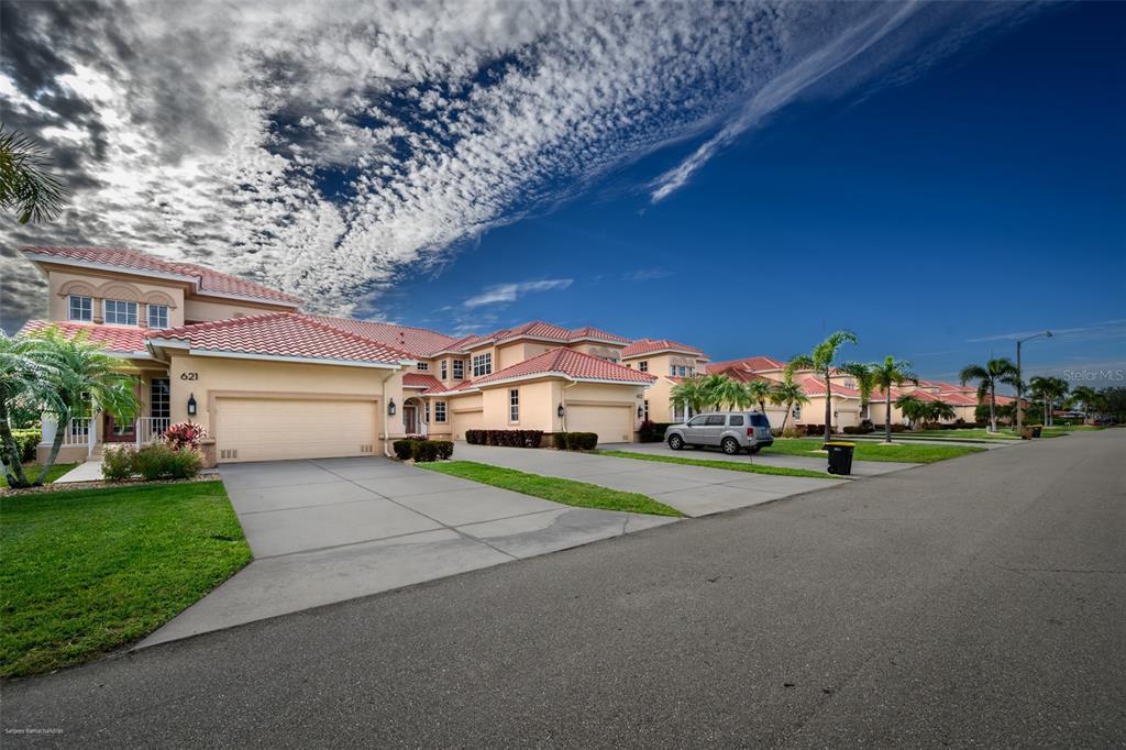 3959 San Rocco Drive, Unit 612 Punta Gorda, FL 33950 - Photo 2 of 41 a view of a house with a yard and pathway