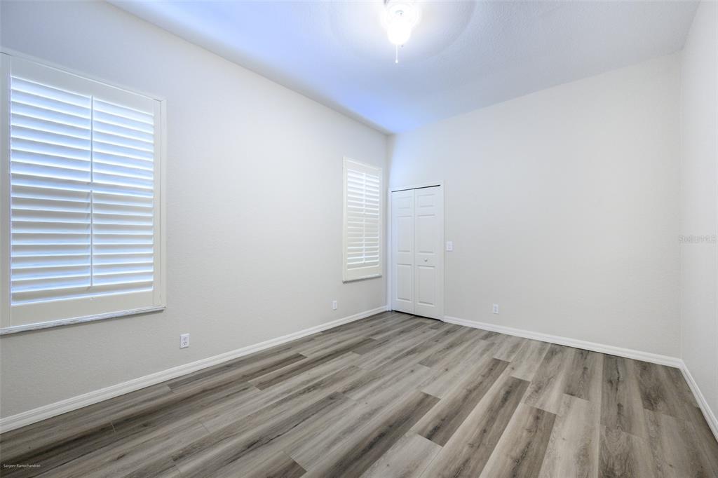 3959 San Rocco Drive, Unit 612 Punta Gorda, FL 33950 - Photo 26 of 41 a view of an empty room with wooden floor and a window