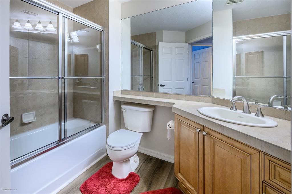 3959 San Rocco Drive, Unit 612 Punta Gorda, FL 33950 - Photo 30 of 41 a bathroom with a sink toilet and shower