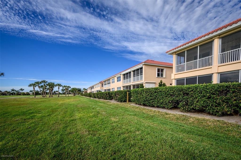 3959 San Rocco Drive, Unit 612 Punta Gorda, FL 33950 - Photo 39 of 41 a front view of a house with a yard