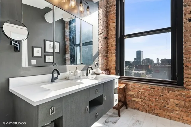 a bathroom with a sink and a mirror