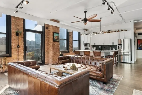 a living room with furniture and a large window
