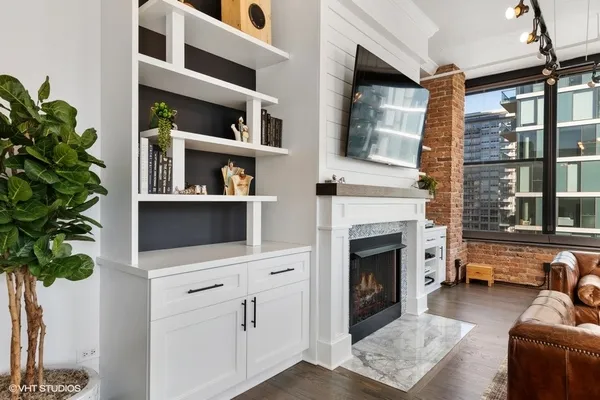 a living room with furniture and a fireplace