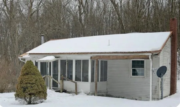 a view of a house with a backyard