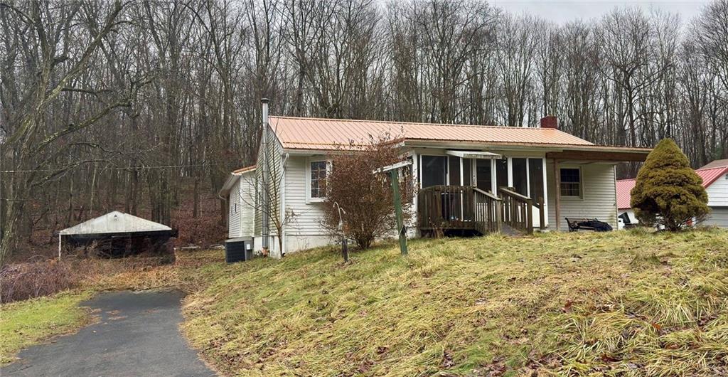 455 Adrian Sherrett Road Adrian, PA 16210 - Photo 2 of 11 a view of a house with a yard and sitting area