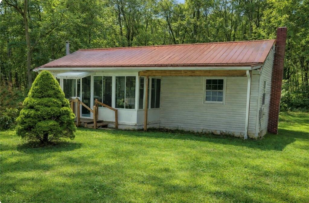 455 Adrian Sherrett Road Adrian, PA 16210 - Photo 2 of 17 a view of a house with a garden