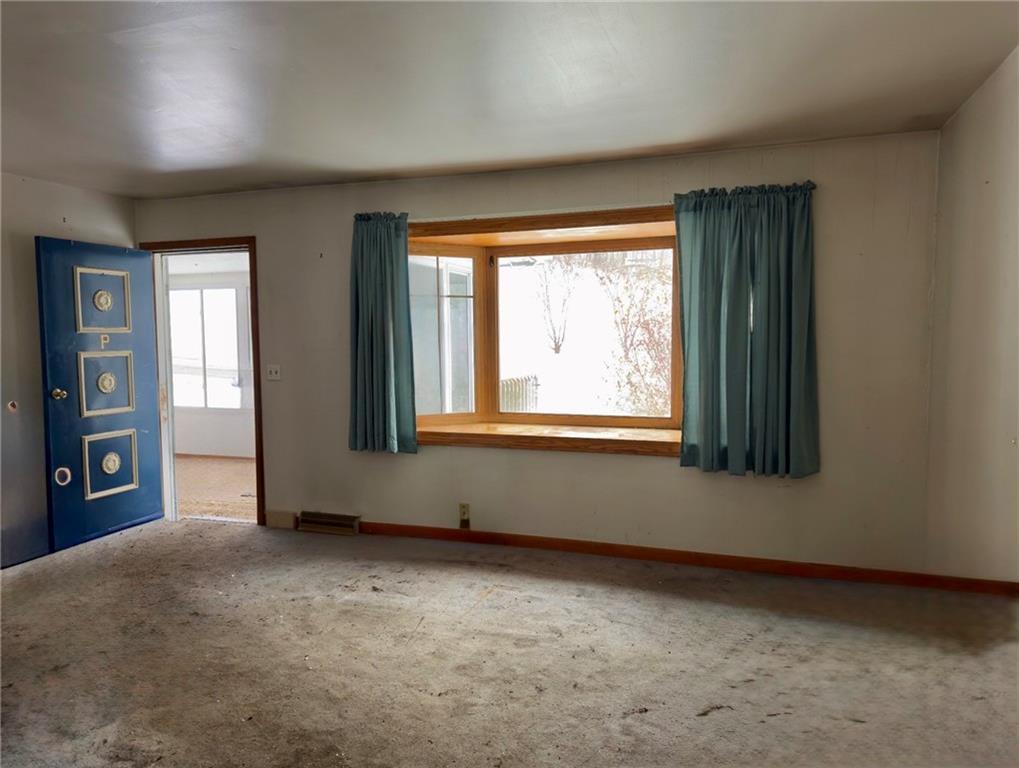 455 Adrian Sherrett Road Adrian, PA 16210 - Photo 4 of 11 an empty room with windows