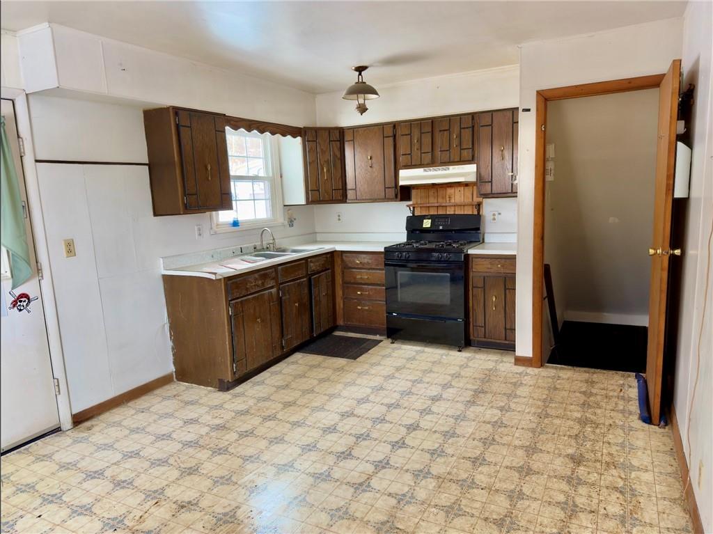 455 Adrian Sherrett Road Adrian, PA 16210 - Photo 5 of 16 a kitchen with stainless steel appliances granite countertop a refrigerator stove and sink