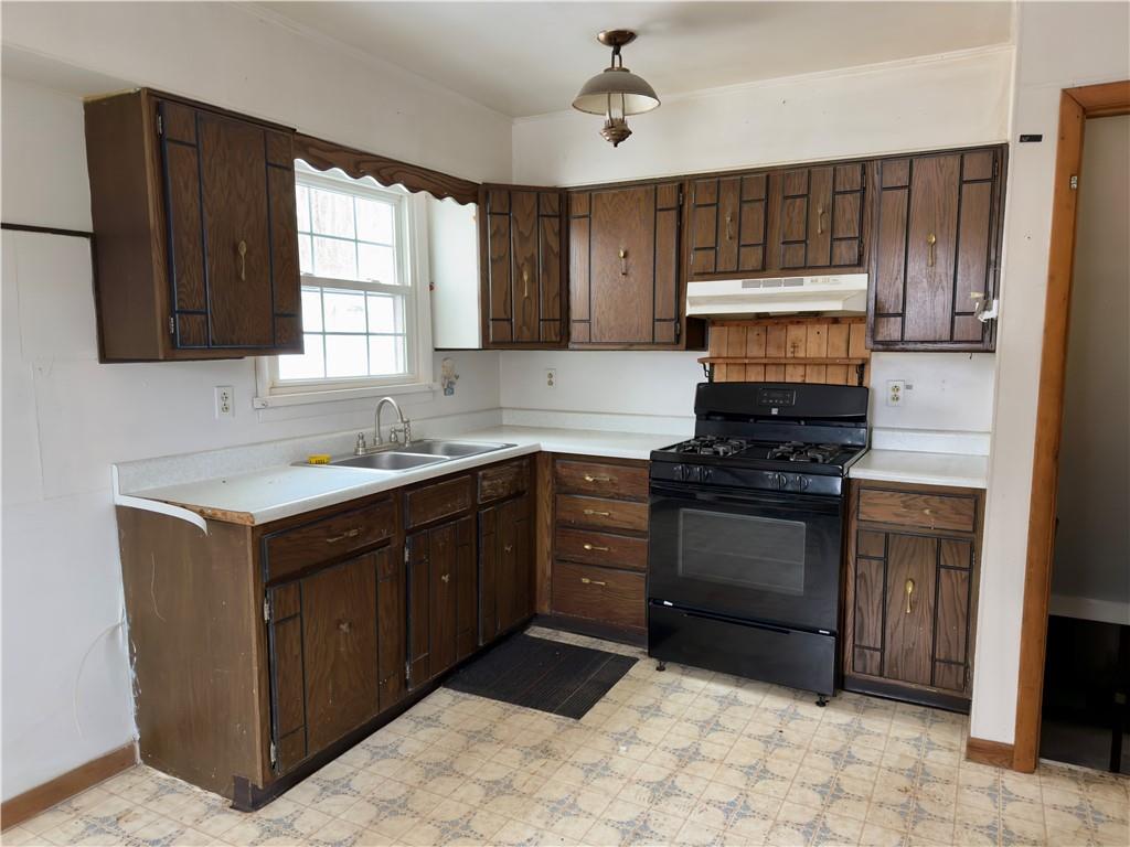 455 Adrian Sherrett Road Adrian, PA 16210 - Photo 6 of 16 a kitchen with a sink stove and microwave
