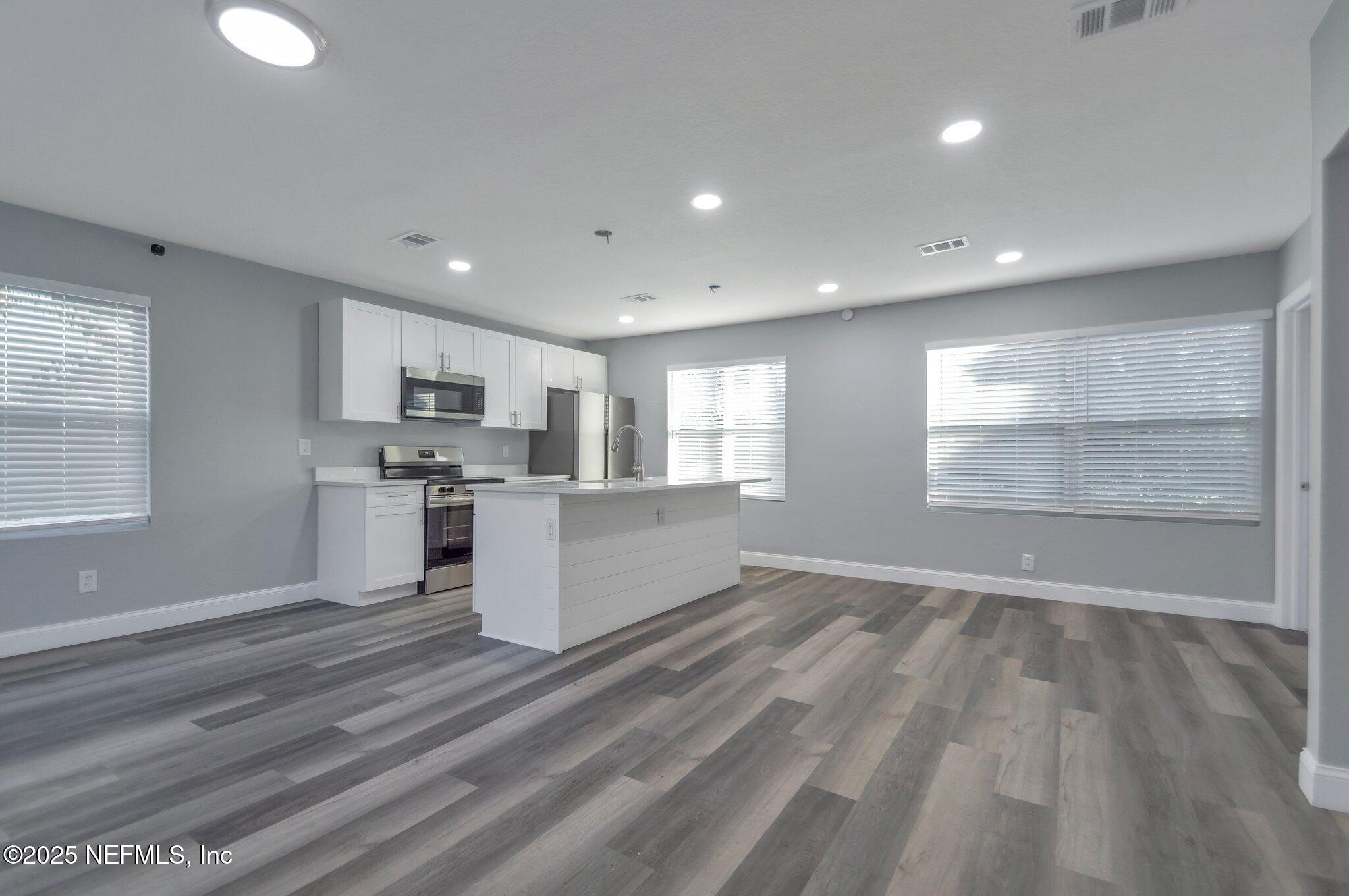 1759 Planters Road Jacksonville, FL 32207 - Photo 6 of 16 a view of kitchen with wooden floor