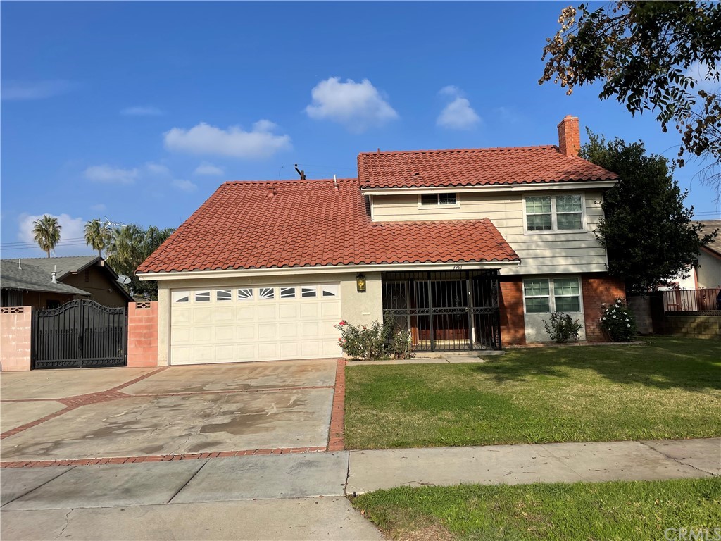 3961 Redondo Street Riverside, CA 92505 - Photo 1 of 1 a front view of a house with a garden and yard