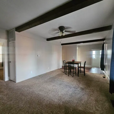 a view of game room with windows