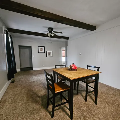 a room with furniture and a wooden floor