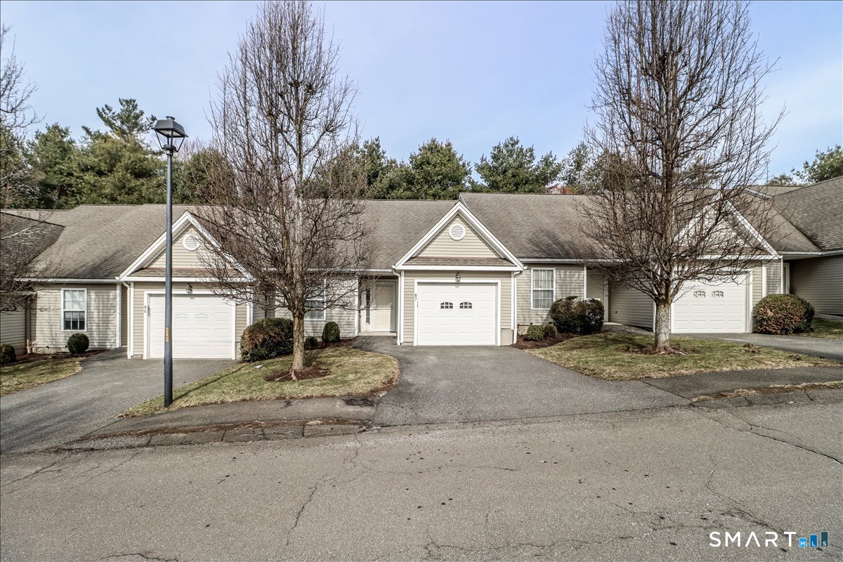 a view of house with a street