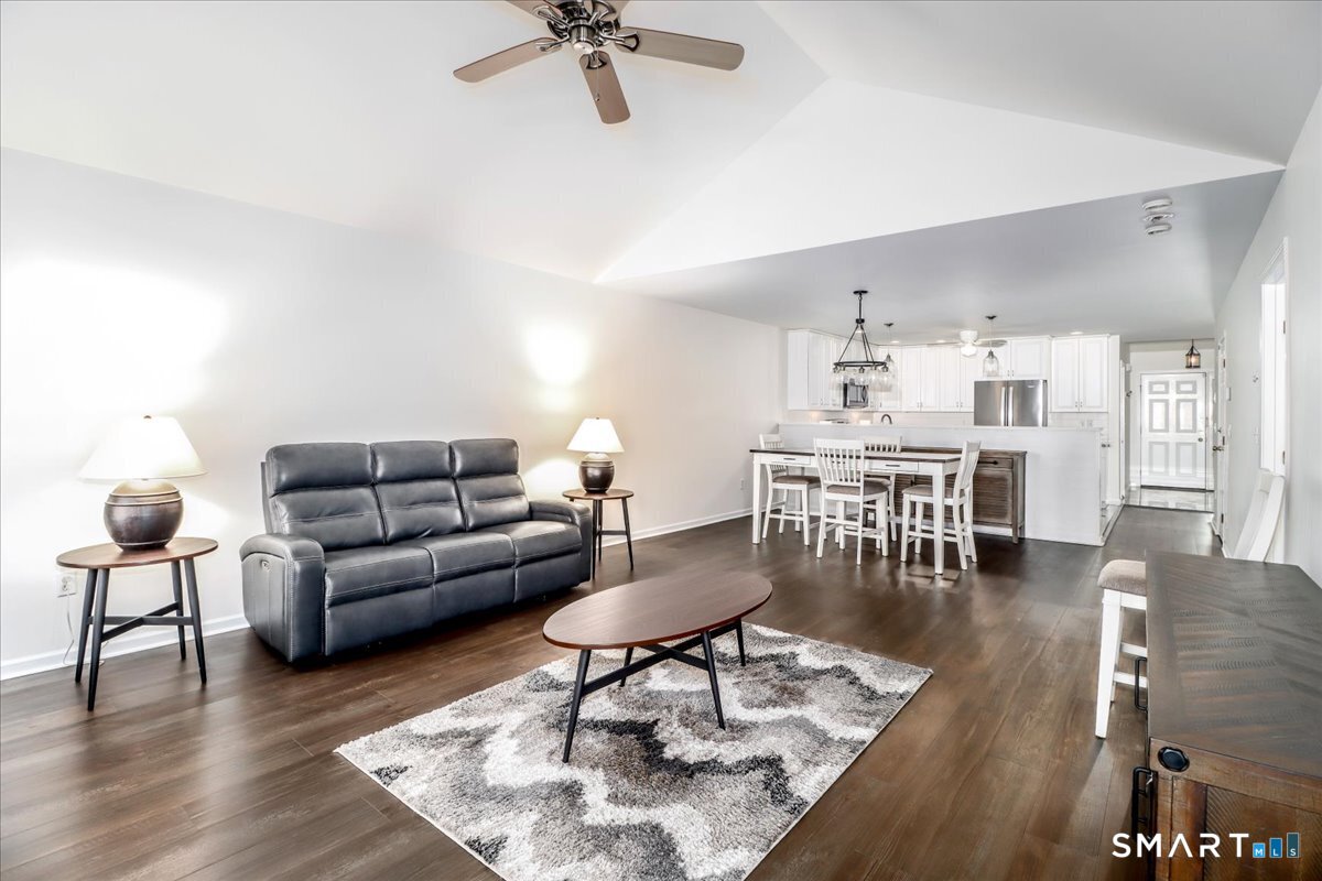 87 Haley Lane, Unit 87 Newtown, CT 06482 - Photo 14 of 39 a living room with furniture and a wooden floor