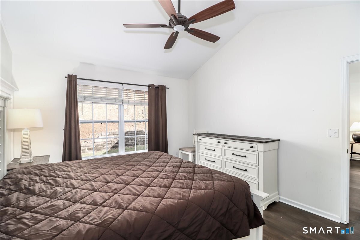 87 Haley Lane, Unit 87 Newtown, CT 06482 - Photo 17 of 39 a bedroom with a bed and a window