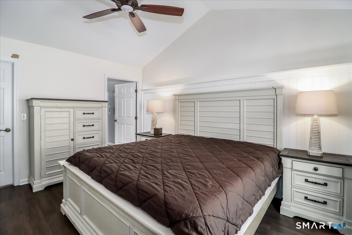 87 Haley Lane, Unit 87 Newtown, CT 06482 - Photo 18 of 39 a bedroom with a bed and a dresser