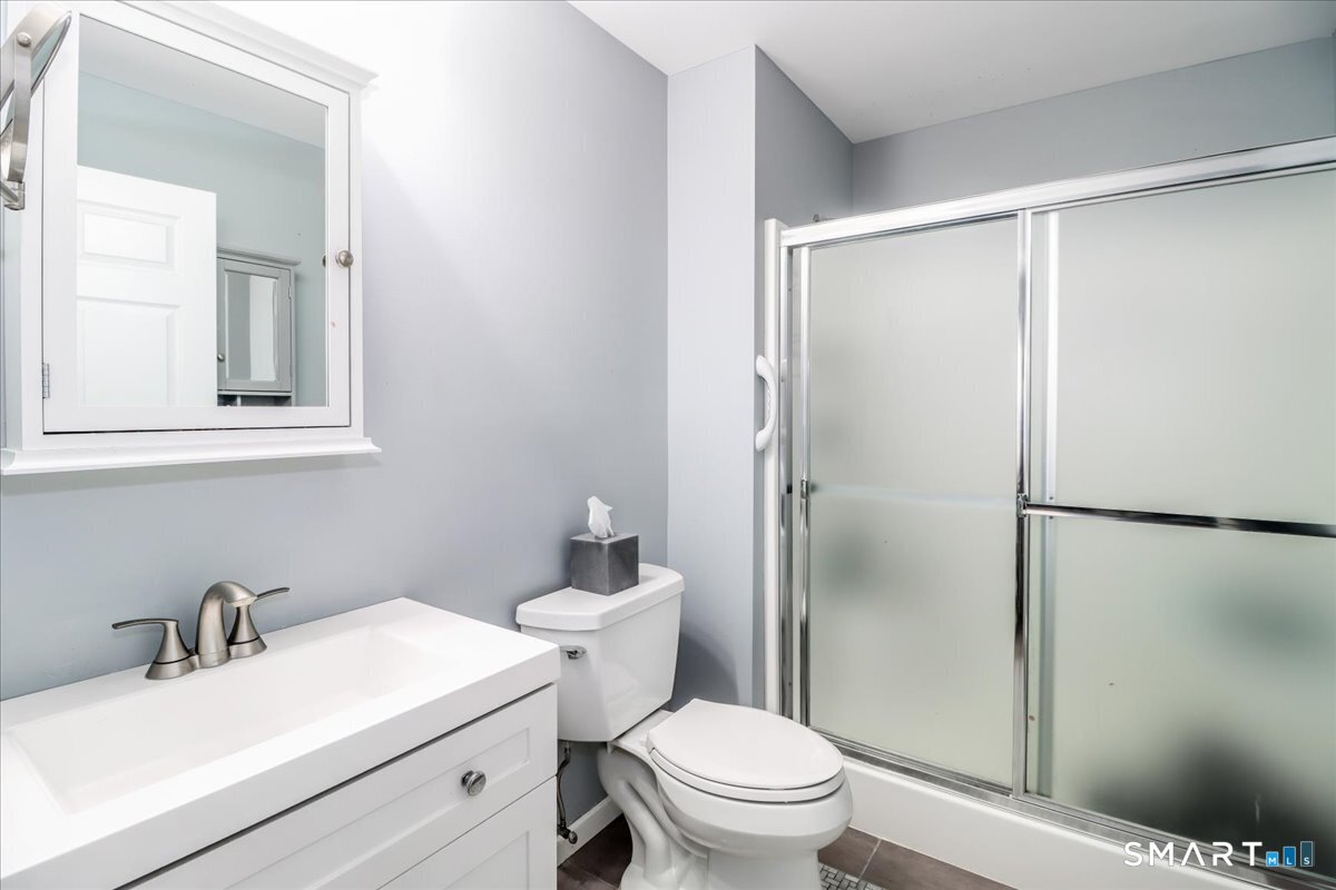 87 Haley Lane, Unit 87 Newtown, CT 06482 - Photo 19 of 39 a bathroom with a sink toilet and shower