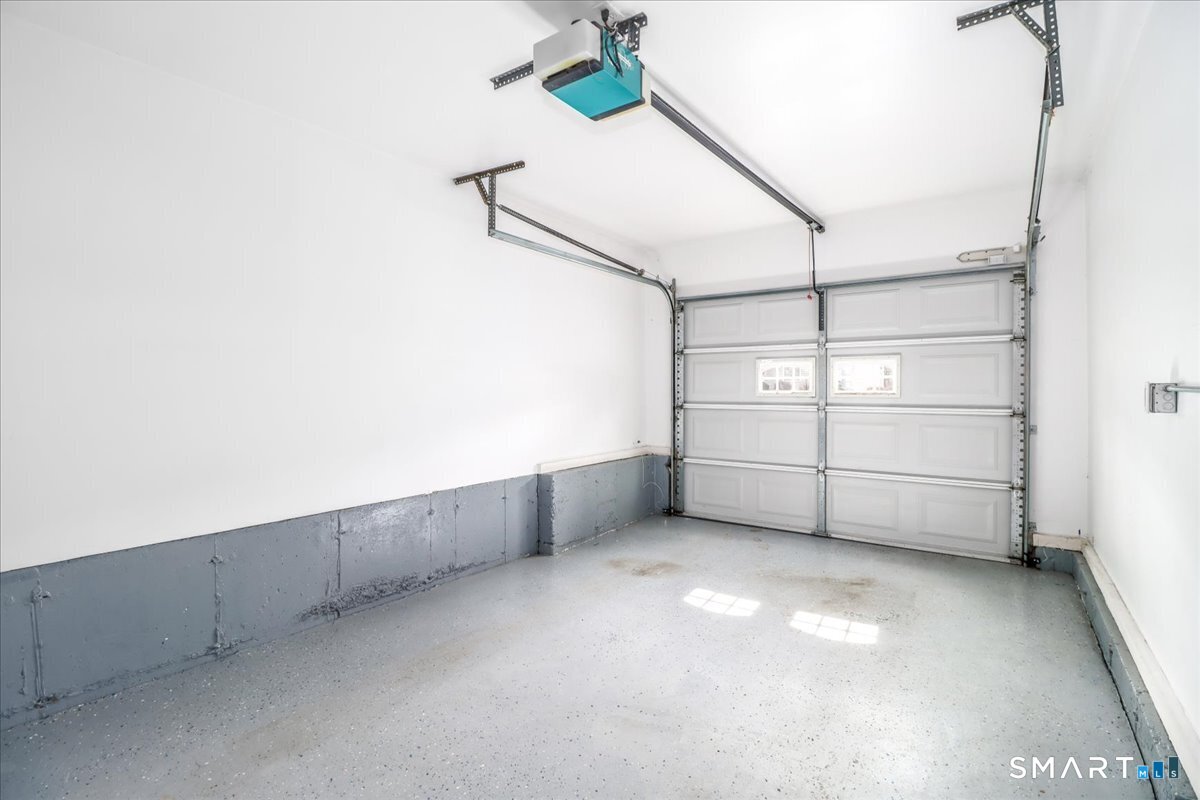 87 Haley Lane, Unit 87 Newtown, CT 06482 - Photo 29 of 39 a view of a garage with racks
