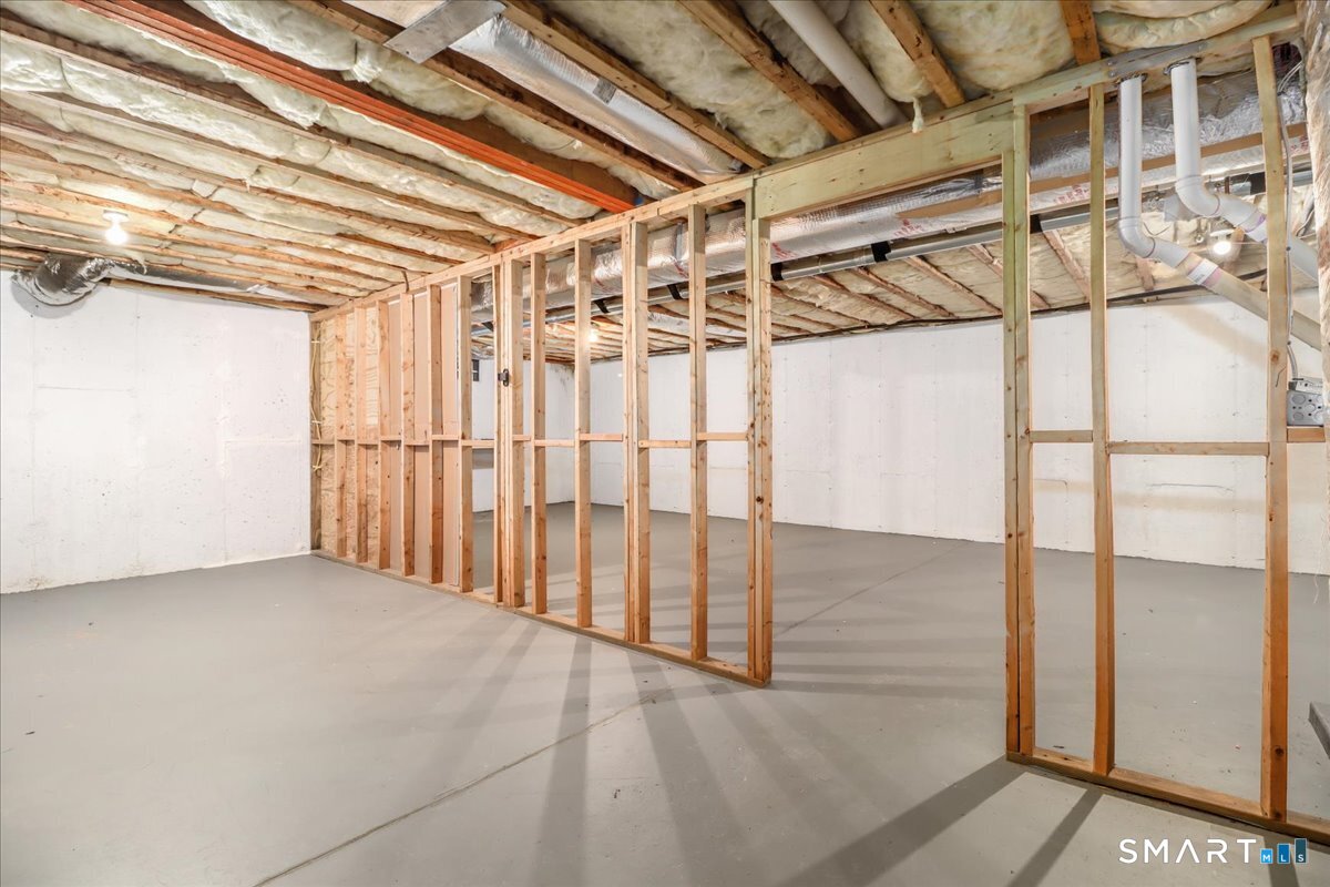 87 Haley Lane, Unit 87 Newtown, CT 06482 - Photo 30 of 39 a view of a room with wooden walls