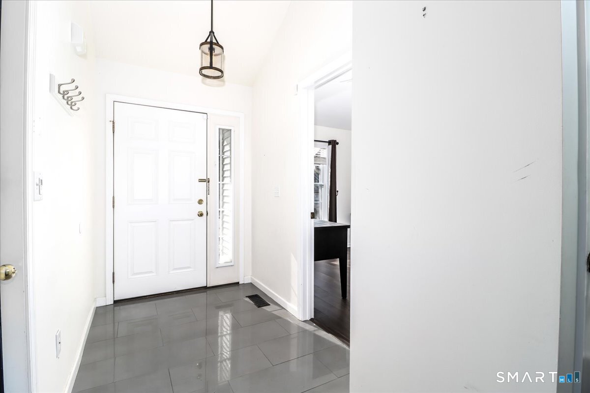 87 Haley Lane, Unit 87 Newtown, CT 06482 - Photo 3 of 39 a view of a hallway with closet