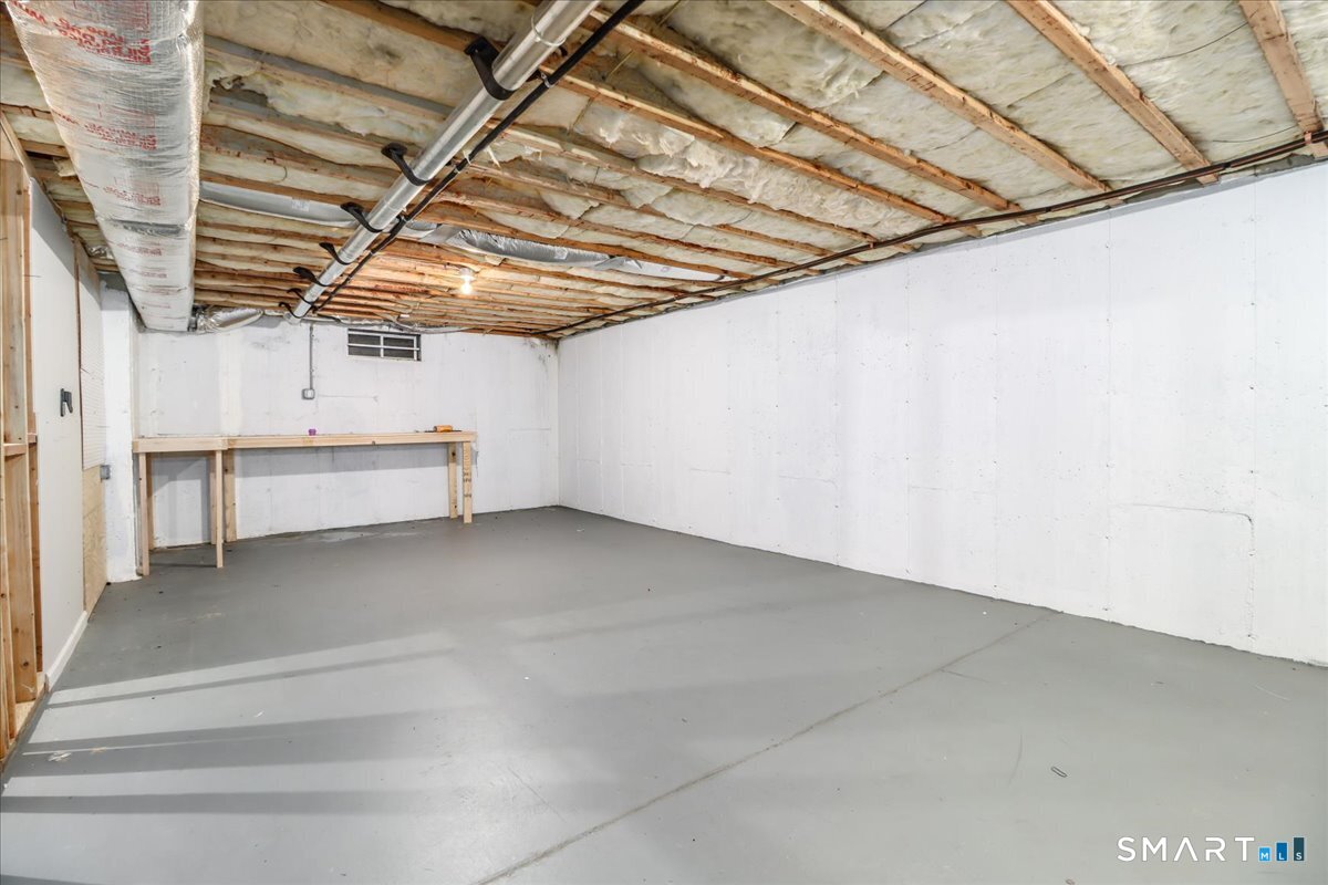 87 Haley Lane, Unit 87 Newtown, CT 06482 - Photo 32 of 39 a view of a room with racks on the wall