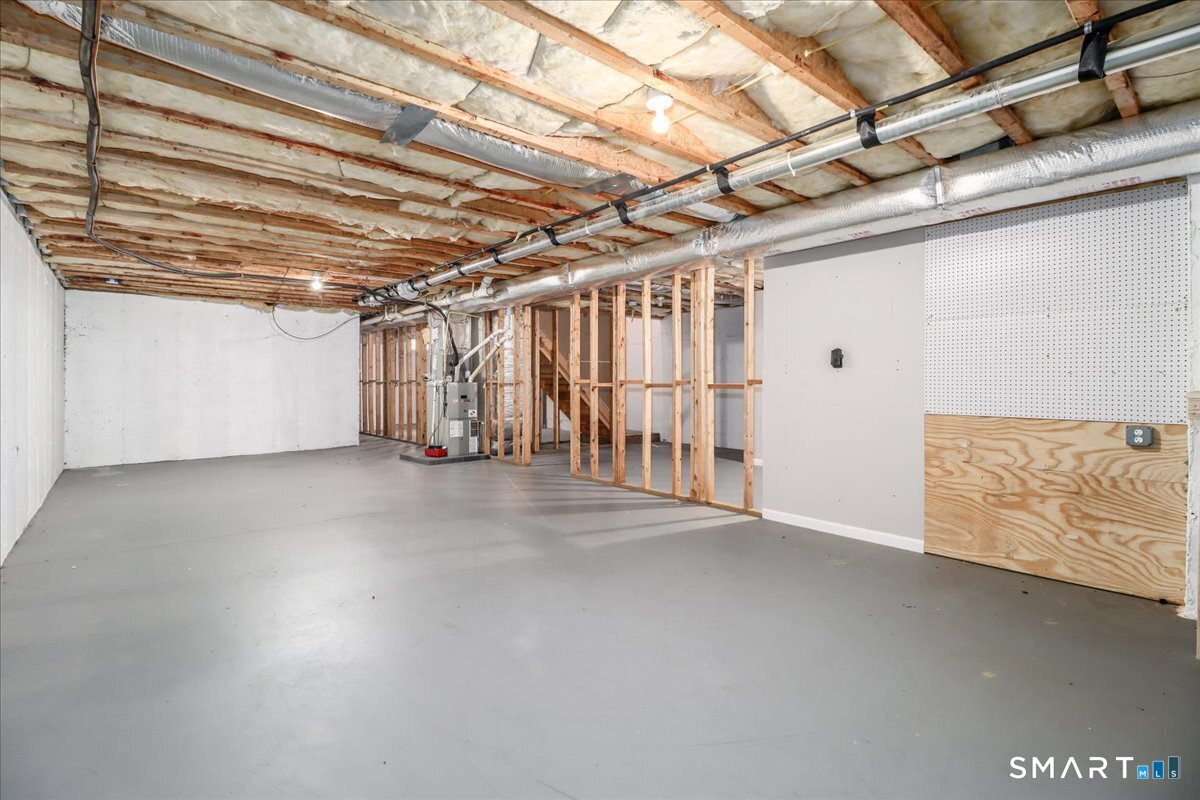 87 Haley Lane, Unit 87 Newtown, CT 06482 - Photo 33 of 39 a view of a room with wooden walls