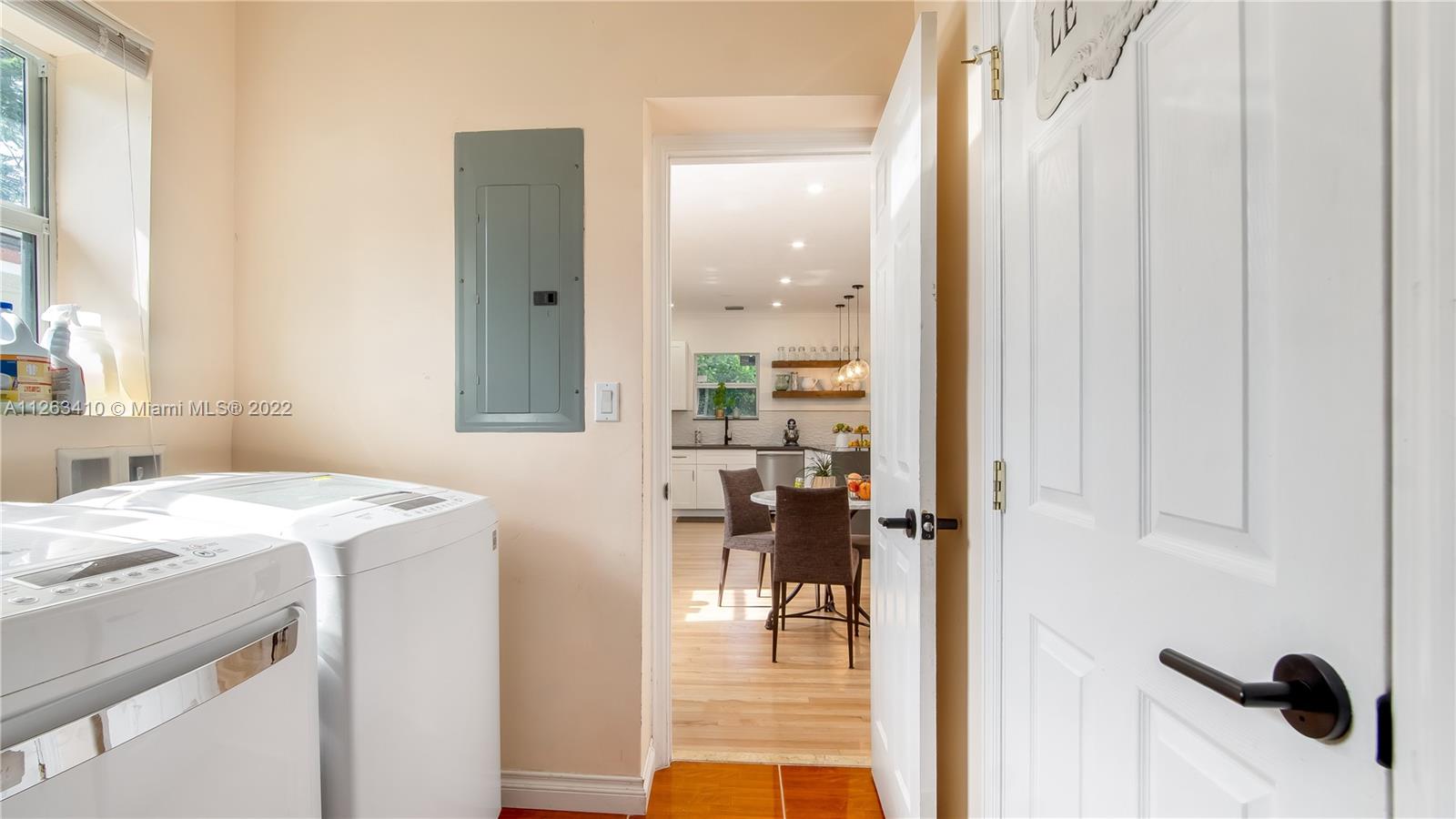 635 Bird Road Coral Gables, FL 33146 - Photo 20 of 35 a bathroom with a sink and a mirror