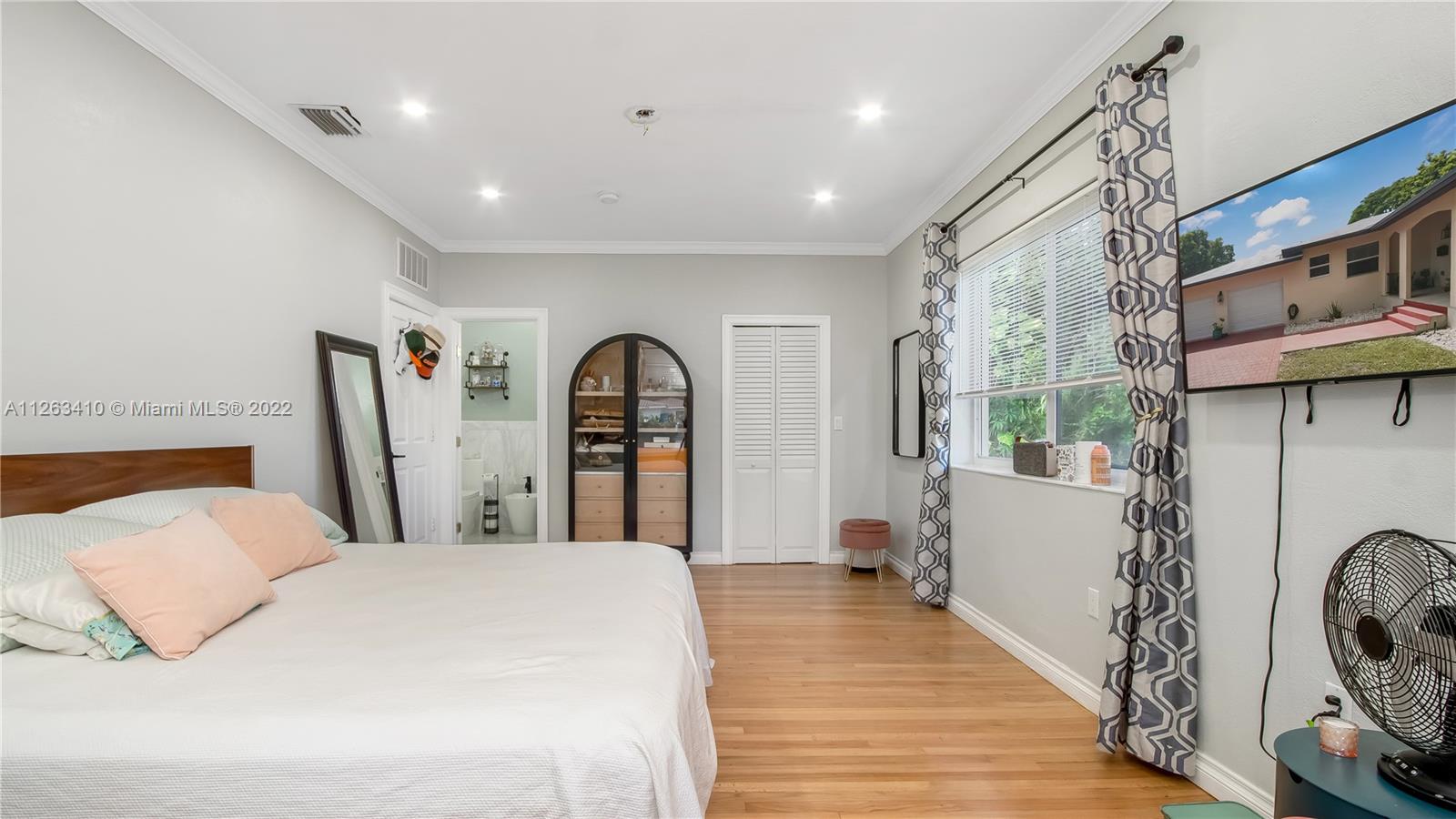 635 Bird Road Coral Gables, FL 33146 - Photo 24 of 35 a bed room with furniture and a window