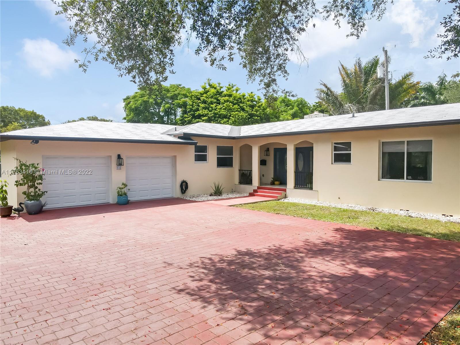 635 Bird Road Coral Gables, FL 33146 - Photo 3 of 35 a house view with a backyard space